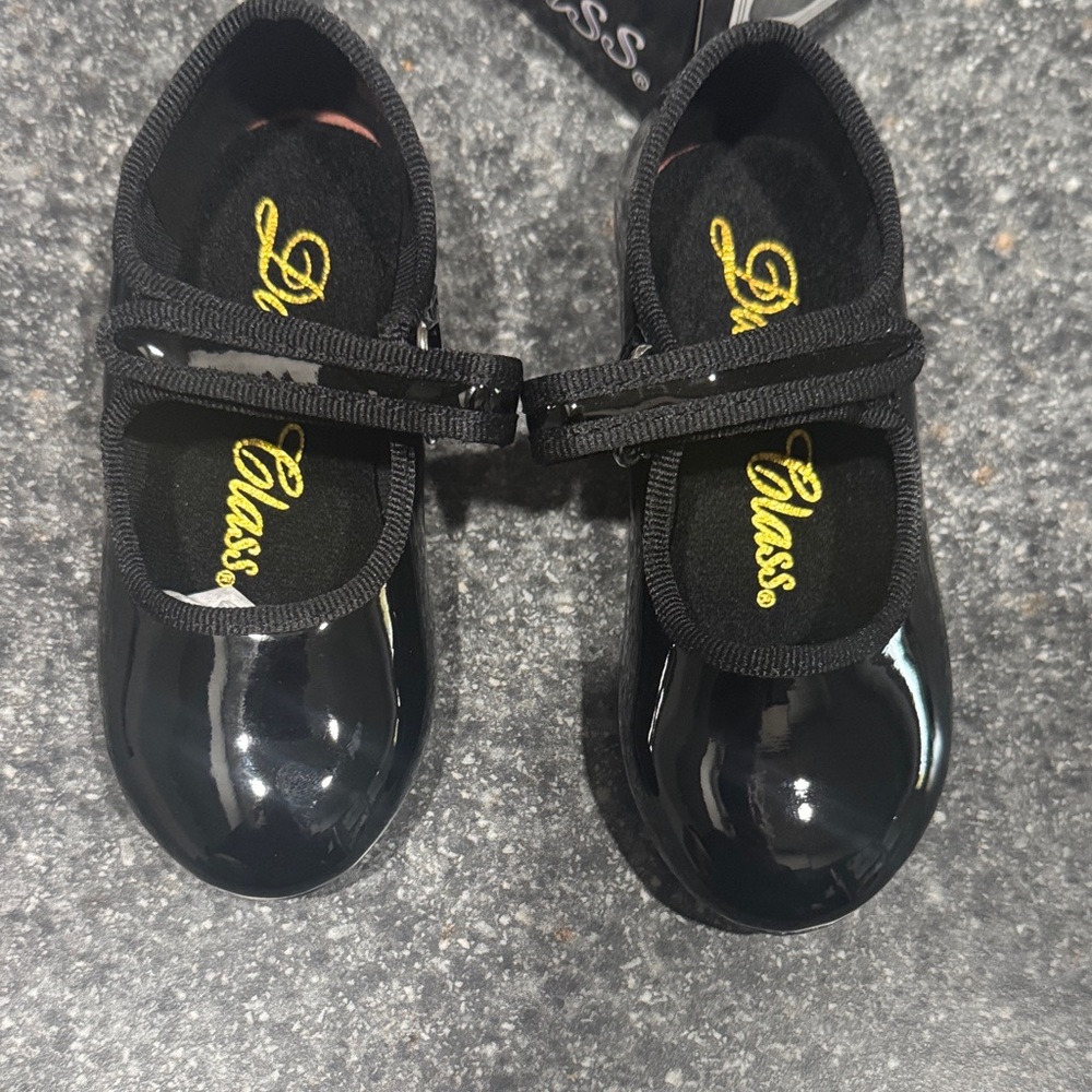 Girls black tap shoes. Never worn
